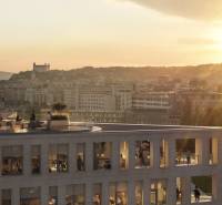 A view of the building at sunset in Bratislava, Pribinova, with a view of the castle.