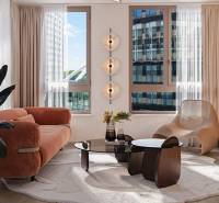Living room in a three-room apartment with a sofa and a wooden decor floor.