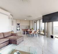 Interior of a 3-room apartment with a wooden decor floor and large window areas.