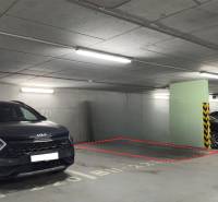 Parking space between vehicles in the garage on Račianska Street 26 F in Bratislava.