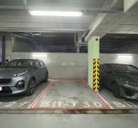 Parking spot BII-130 between two cars in the garages.