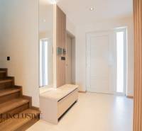 Interior of a family house with a staircase and a wooden decor floor.