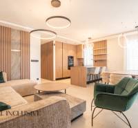 A living room in a family house with a wooden decor floor and modern furniture.