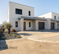 Family house in Gyor-Moson-Sopron, with a garage, minimalist front garden with stones.