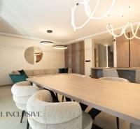 Interior of a family house with elegant furniture, circular lighting fixtures, and mirror decorations.