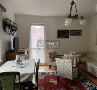 Interior of a family house with furniture, TV, table, sofa, and floor with wood decor.