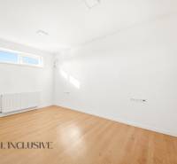 Bright space with white walls and a floor with a wooden decor.