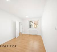 White walls and a wooden decor floor in commercial spaces.