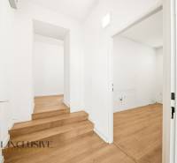 White walls and a wooden decor floor in commercial premises.
