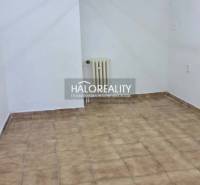 Office interior with tiled floor and white wall.