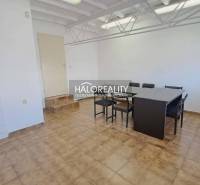 Offices with a dining table and tiles, a sink in the corner of the room.