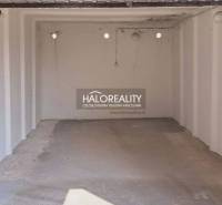 An empty garage with a concrete floor, part of offices in Senec.