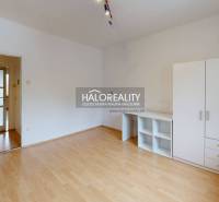 A 2-room apartment with a bright interior and furniture, and a floor with a wooden decor.