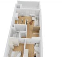 Floor plan of a 3-room apartment with wood-patterned floors and functional room arrangement.