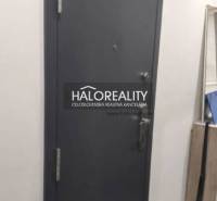 Entrance door in a 3-room apartment with a dark design and white walls.