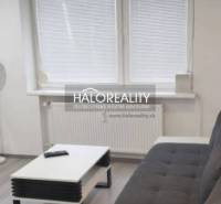 Living room in a 3-room apartment with a dark gray sofa and a coffee table.