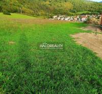 A view of residential plots in Margecany surrounded by wooded countryside.
