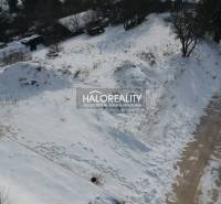 Snow cover on residential plots in Liptovské Beharovce, winter landscape.