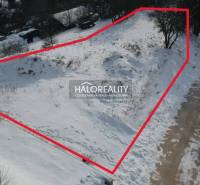 Snow-covered residential lands in Liptovské Beharovce, bordered by a red line.