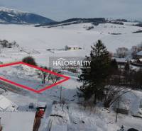Snow-covered residential lands in Liptovské Beharovce with a beautiful mountain view.