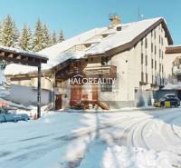 A snow-covered area of a hotel complex and parking lot in Vyšná Boca, suitable for hotels and guesthouses.