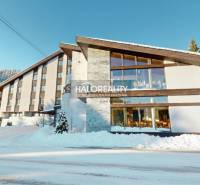The image shows a hotel with a snowy landscape in Vyšná Boca, Hotels and guesthouses.