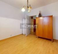 A room in a 3-room apartment with a closet and a floor with a wooden decor.