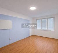 A room in a 4-room apartment with a wooden decor floor and a large window.