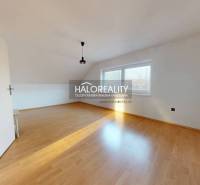 A bright room with wood-decor flooring in a family house, large windows.