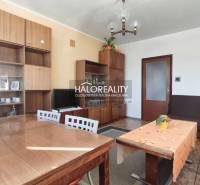 Living room in a 3-room apartment with furniture and ceiling chandelier lighting.