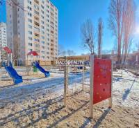 A playground with climbing frames in winter near a block of flats in Petržalka, Bratislava.