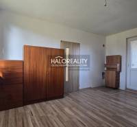 The interior of a family house with a wooden decor floor and wooden cabinets.