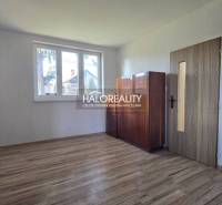 Interior of a family house with a wooden decor floor and light furniture.