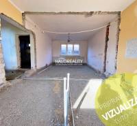 A house under renovation with exposed walls and bare floors.