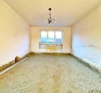 An empty room with an unfinished floor in a family house.