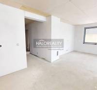 An unfinished interior with white walls and an open floor plan in an office.