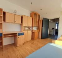 A room with wooden decor furniture and flooring in a 3-room apartment.