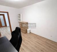 Cozy study room with a desk, chair, and wooden decor flooring in a 3-room apartment.