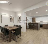 Dining room and kitchen in a family house with a wooden decor floor.