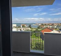 The view from a holiday apartment in Nin of the Adriatic Sea and surrounding houses.