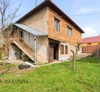 A family house in Malá nad Hronom with access via an external staircase and a garden.