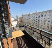 The balcony of a 3-room apartment on Bernolákova Street in Bratislava - Old Town with a wooden decor.