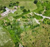Aerial view of residential plots in Tornaľa with surrounding greenery.