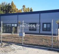 A building with a modern design on a fenced plot in the town of Tornaľa, suitable for living.