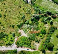 Aerial view of extensive residential land in Tornaľa, surrounded by greenery.