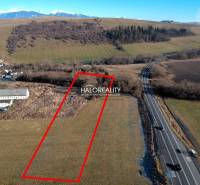 A residential plot in Gôtovany next to the main road with a view of the mountains.