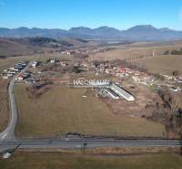 Aerial view of residential plots in Gôtovany surrounded by nature and mountains.