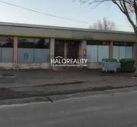 Property for sale: building with display windows, suitable for commercial spaces, main street.