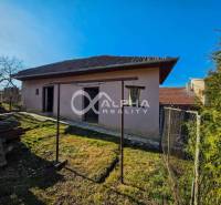 A family house in Spišské Vlachy with a plot, fencing, and storage space in the yard.