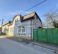 A family house in Rimavská Sobota with a gate and facade on a quiet street.